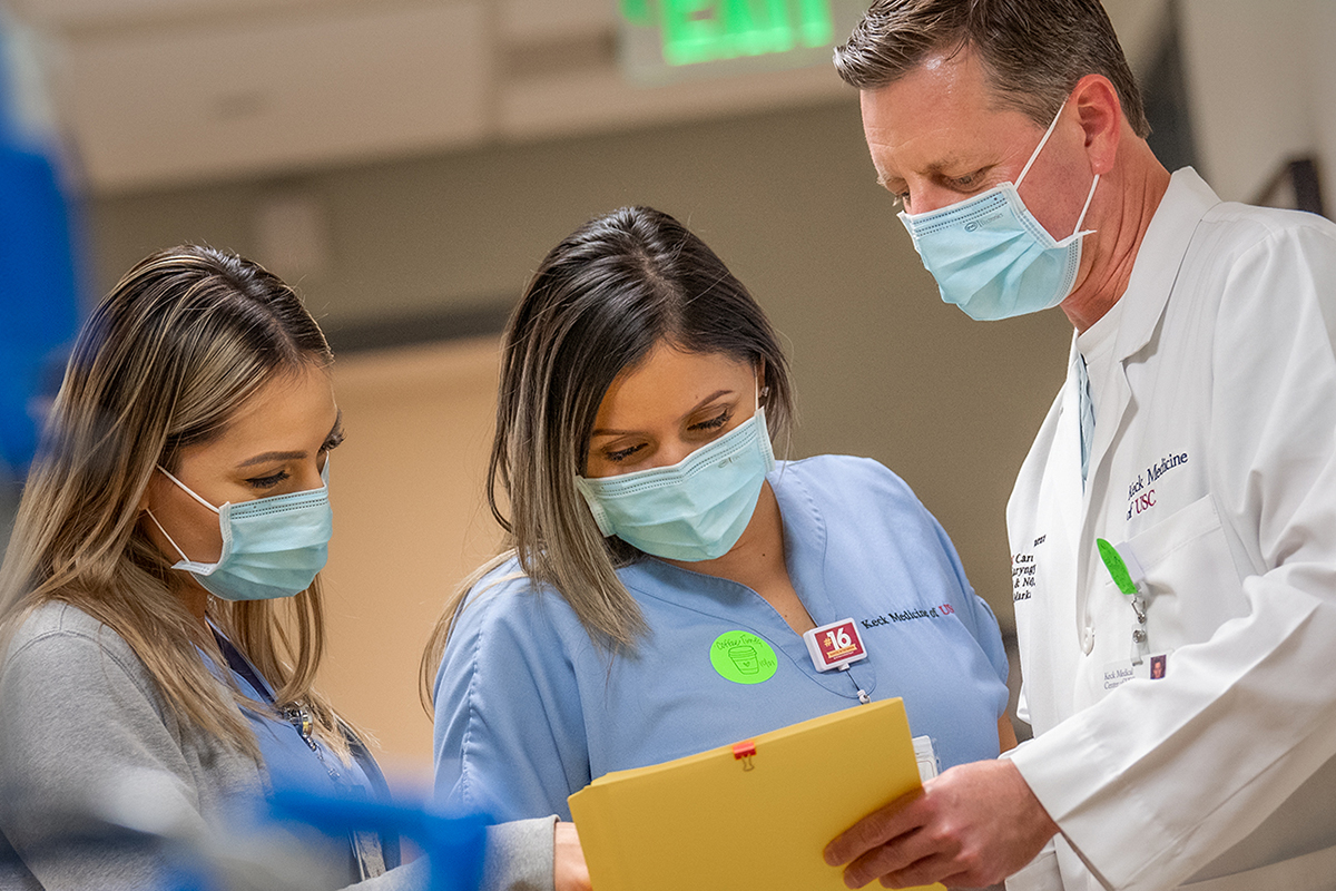 Three Keck Medicine of USC health care staff