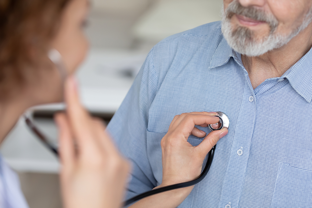 Doctor examining a patient's chest with a stethoscope