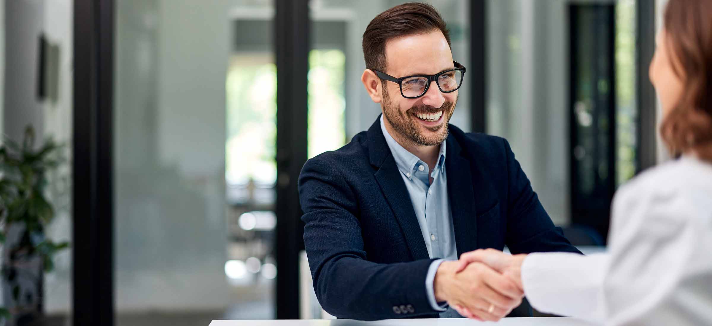 A man shakes a doctors hands during an executive health assessment.