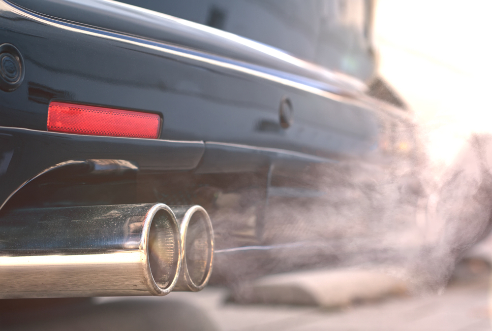 A closeup of exhaust coming from a car with a diesel engine