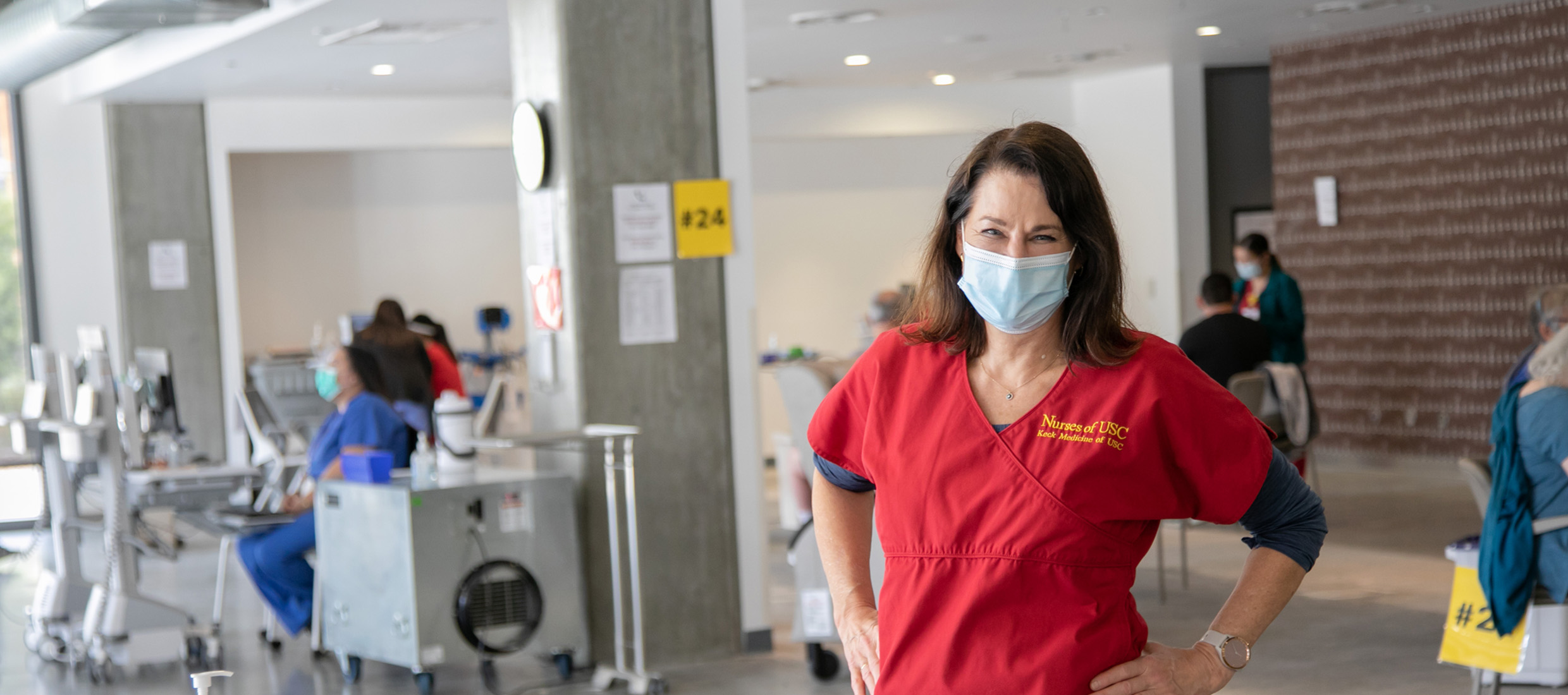 Nurse standing in front of the COVID-19 vaccine clinic at Keck Hospital of USC