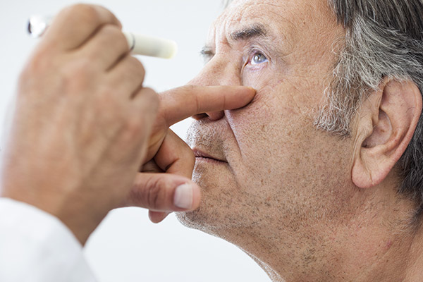 Elderly man examined by an ophthalmologist.