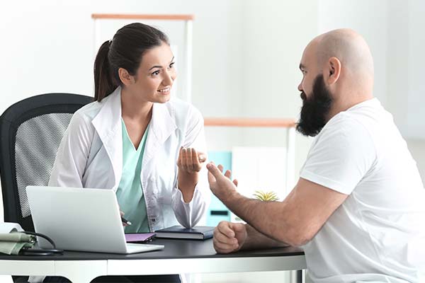 Person consulting with a physician