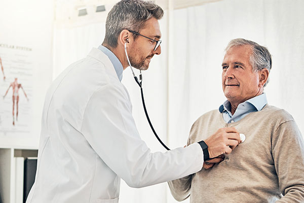 A doctor consults with a man about cardiac resynchronization therapy.