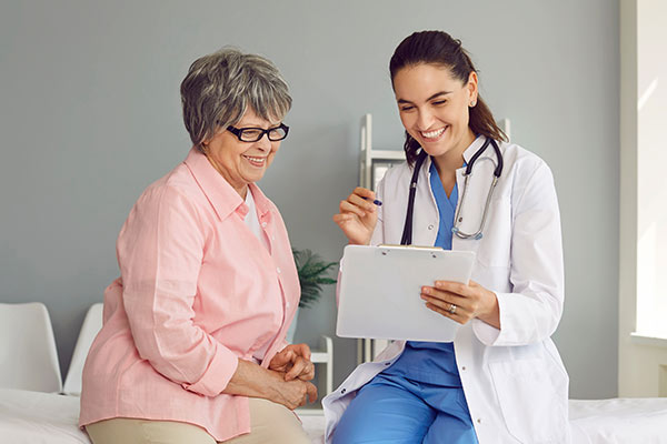A woman consults with a doctor about a pacemaker.